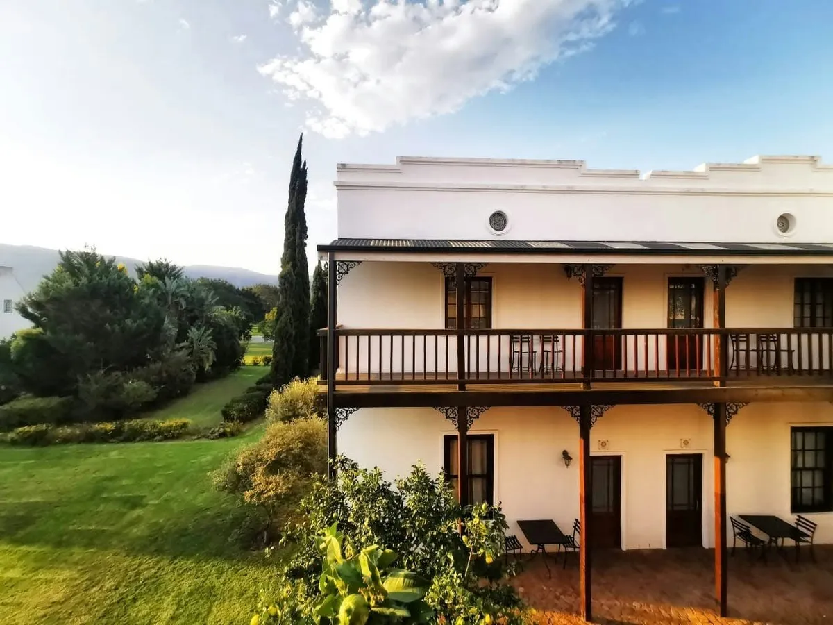 Two-storey farmhouse with balconies and mountain views